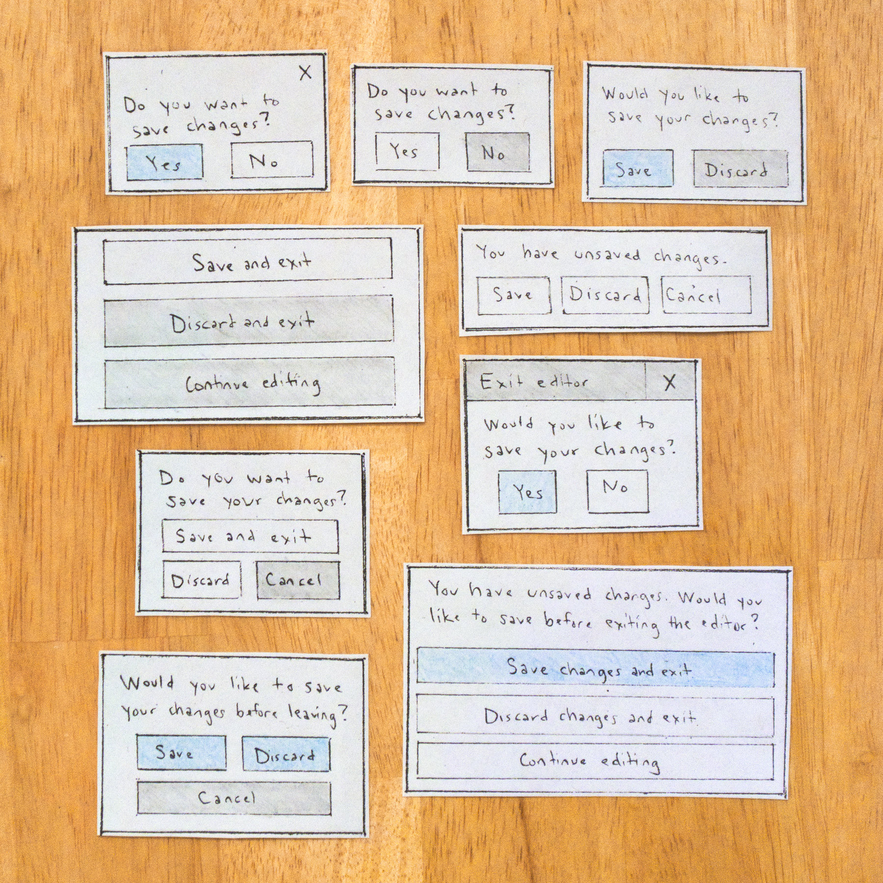 Sketches of 9 variations for a dialog box.              The microcopy varies from 'Yes' and 'No' to 'Save and exit' or 'Continue editing'
