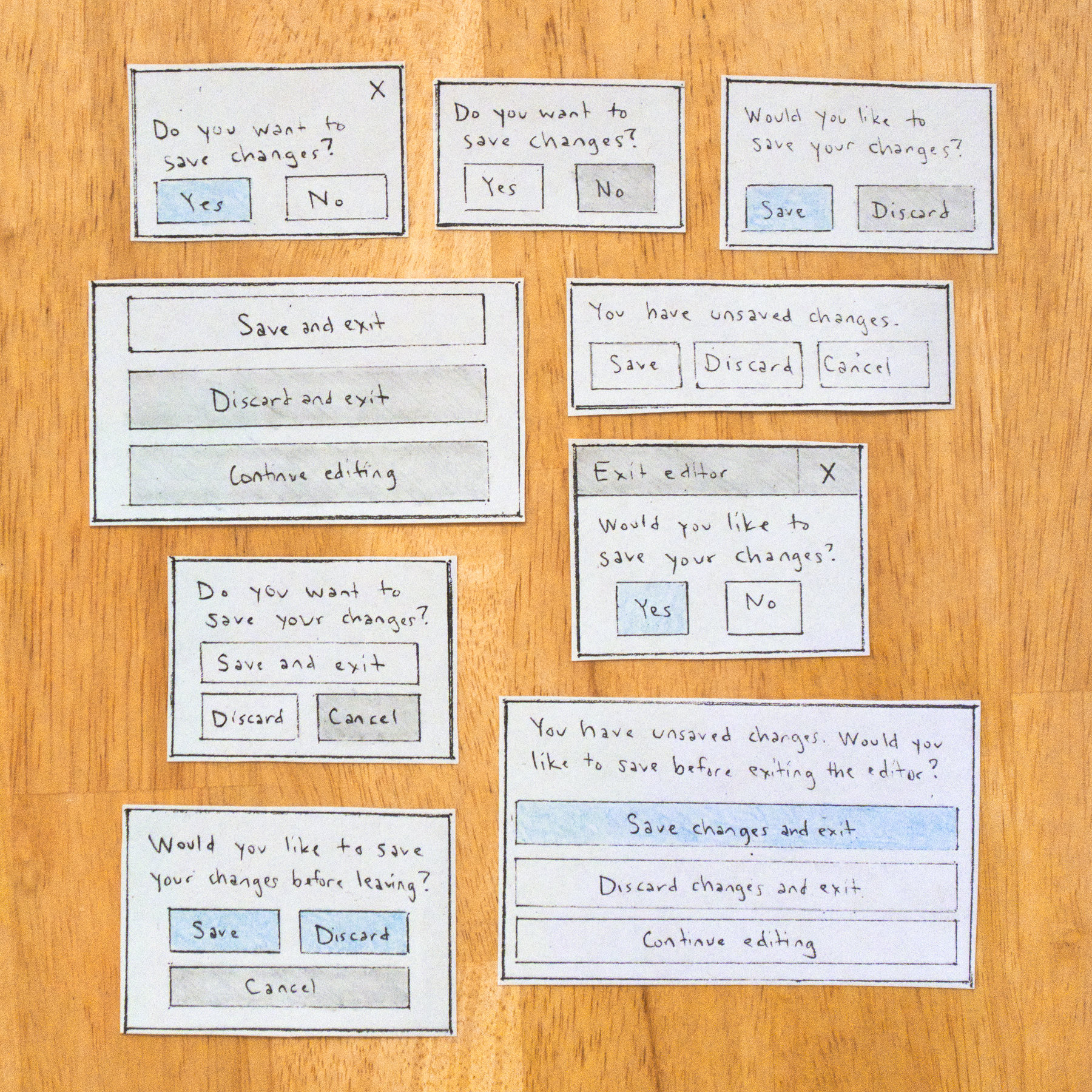 Sketches of 9 variations for a dialog box. 
    The microcopy varies from 'Yes' and 'No' to 'Save and exit' or 'Continue editing'